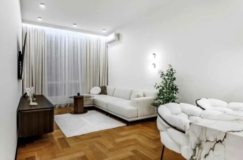 Open-plan living room with kitchen and modern interior design in apartment for sale in Kyiv, Bulvarno-Kudriavska Street 17A, Shevchenkivskyi District, new modern building