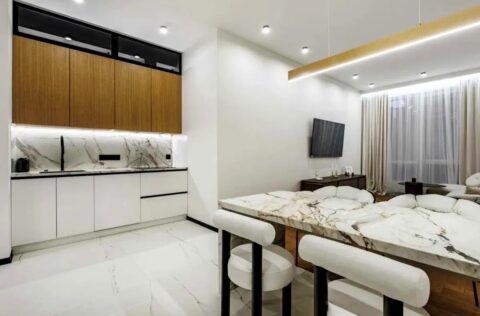 Open-plan living room with kitchen and modern interior design in apartment for sale in Kyiv, Bulvarno-Kudriavska Street 17A, Shevchenkivskyi District, new modern building