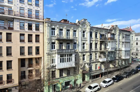 Facade of stalinka building on Yaroslaviv Val 19, Kyiv, historical brick architecture for sale