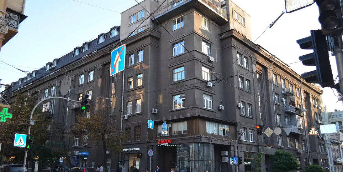 Facade of stalinka building on Yaroslaviv Val 19, Kyiv, historical brick architecture for sale