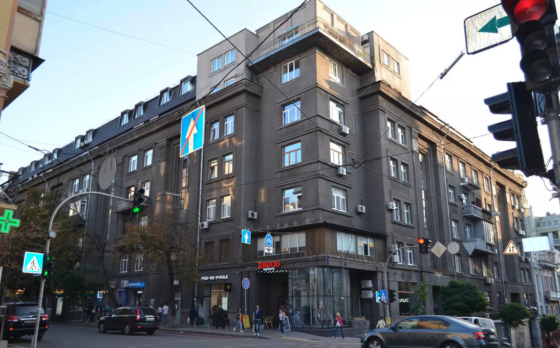 Facade of stalinka building on Yaroslaviv Val 19, Kyiv, historical brick architecture for sale