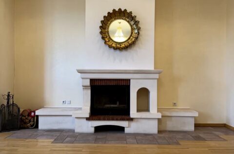 Living room with fireplace in luxury apartment Yevhena Chykalenka 20 Kyiv historical building for sale