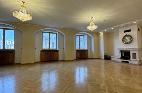 Living room with fireplace in luxury apartment Yevhena Chykalenka 20 Kyiv historical building for sale