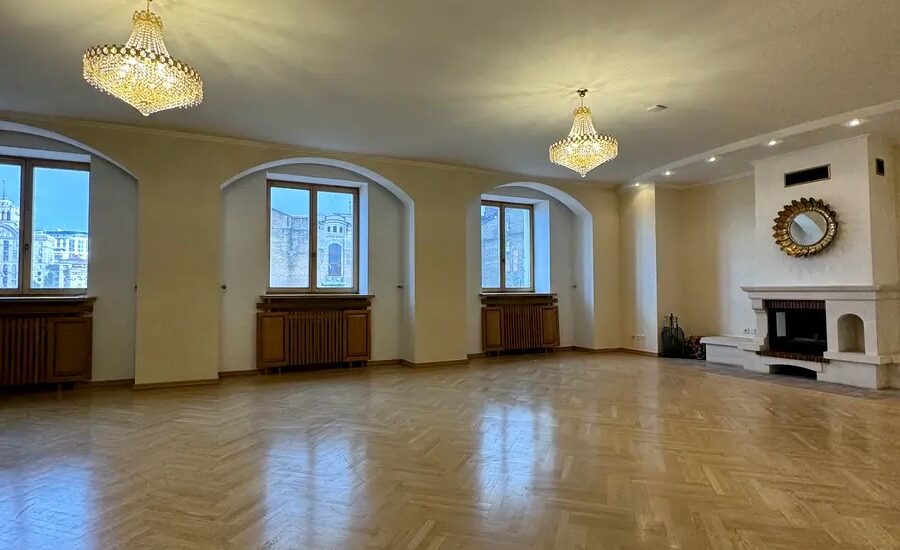 Living room with fireplace in luxury apartment Yevhena Chykalenka 20 Kyiv historical building for sale