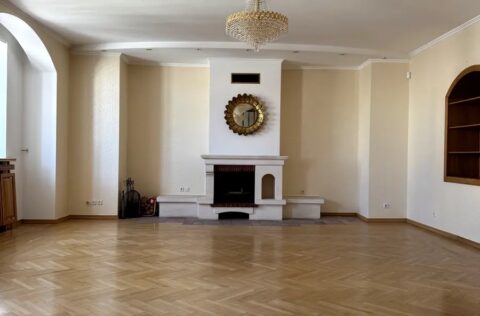 Living room with fireplace in luxury apartment Yevhena Chykalenka 20 Kyiv historical building for sale