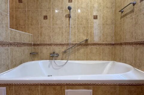 Bathroom with bathtub in duplex apartment on Yevhena Chykalenka 20 Kyiv real estate