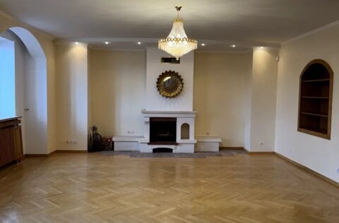 Living room with fireplace in luxury apartment Yevhena Chykalenka 20 Kyiv historical building for sale