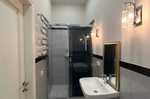 Modern bathroom with shower cabin in renovated Kyiv apartment for sale in Kyiv, Sichovykh Striltsiv 10 Lvivska Square
