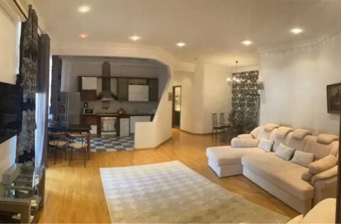 Spacious luxury living room in apartment for sale in Kyiv, Yevhena Chykalenka St., 25, Shevchenkivskyi district with panoramic windows and designer interior
