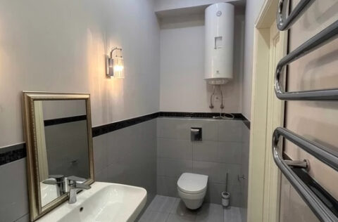Modern bathroom with shower cabin in renovated Kyiv apartment for sale in Kyiv, Sichovykh Striltsiv 10 Lvivska Square