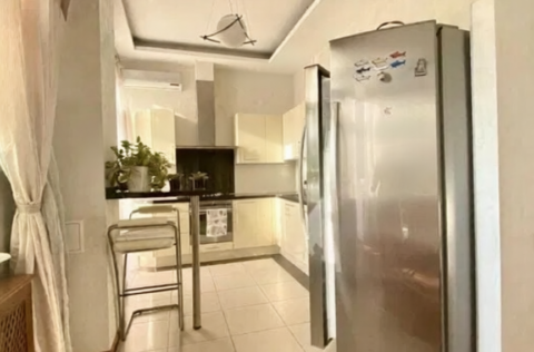 Kitchen in apartment for sale in Kyiv, Yaroslaviv Val 13, spacious kitchen-dining area with modern appliances