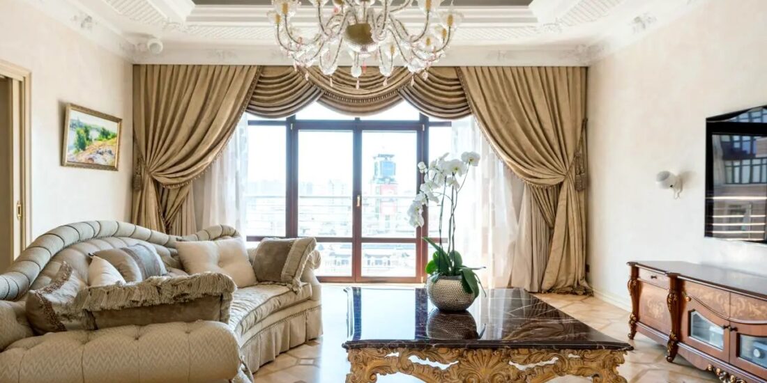 Spacious living room in apartment for sale in Kyiv, Khreshchatyk 27-B, Pecherskyi district, modern luxury residence with panoramic windows and elegant neoclassical interior.
