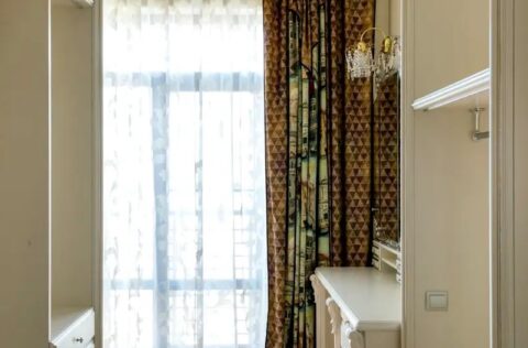 Walk-in wardrobe in apartment for sale in Kyiv, Khreshchatyk 27-B, Pecherskyi district, custom storage system in modern luxury residence.