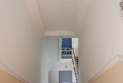 entrance building apartment for sale Kyiv Tarasivska 6A renovated staircase concierge historic building