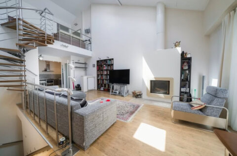 living room with staircase apartment for sale in Kyiv Rylskyi Lane 3 Shevchenkivskyi district penthouse 9m ceilings fireplace