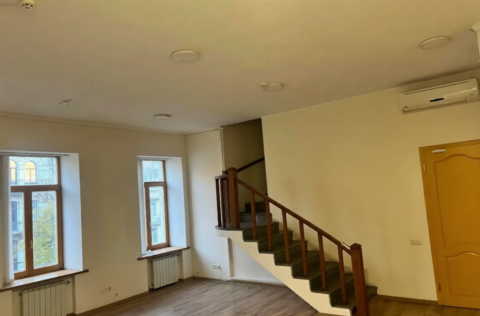 Stairs to the second level in a historic apartment on Volodymyrska Street, Kyiv