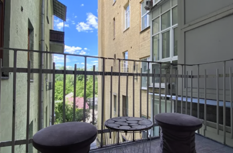Pre-revolutionary elite building balcony on Tarasivska St 8, Kyiv for apartment sale