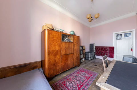 Bedroom in a pre-revolutionary apartment on Yevhena Chykalenka Street 25, Kyiv, requiring renovation