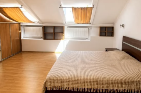Bedroom in a renovated duplex apartment on Tarasa Shevchenka Lane, Kyiv
