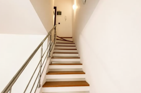 Stairs to the second floor in a duplex apartment on Tarasa Shevchenka Lane, Kyiv