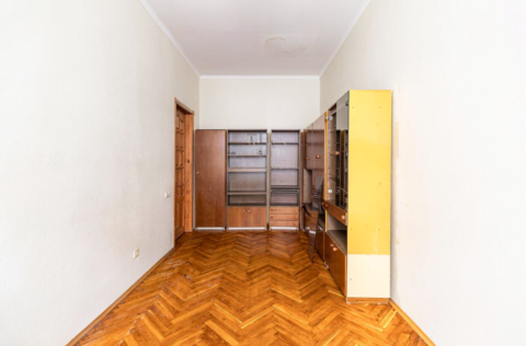 Bedroom in a historic apartment on Prorizna Street 21, Kyiv