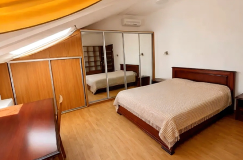 Bedroom in a renovated duplex apartment on Tarasa Shevchenka Lane, Kyiv