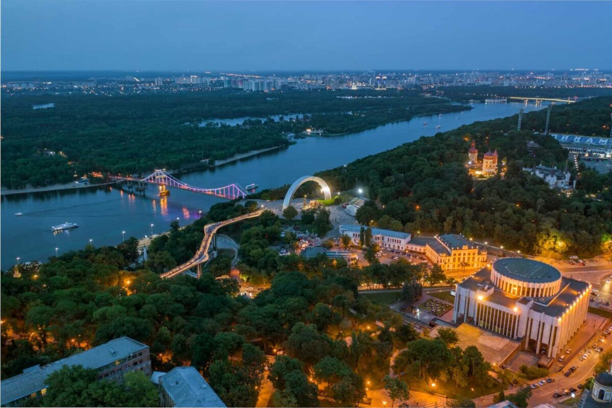 View of Ukrainian House, the pedestrian bridge, and the Arch of Freedom of the Ukrainian People in central Kyiv