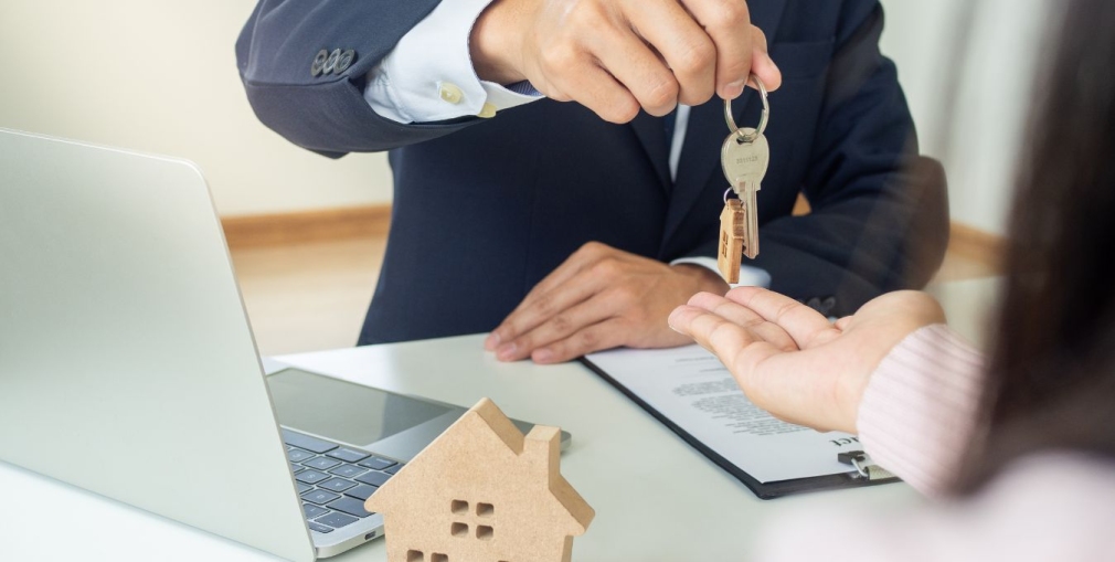 Foreign buyer reviewing apartment documents with a real estate agent in Kyiv